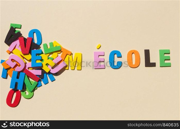 School written in french language with colored letters