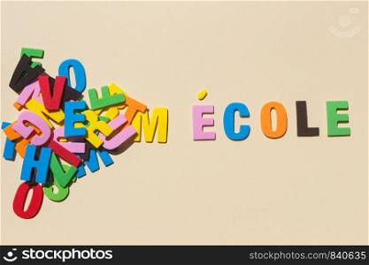 School written in french language with colored letters