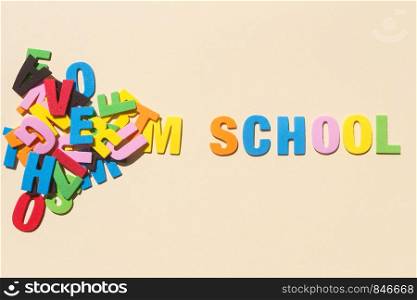 School written with colored letters and heap of letters