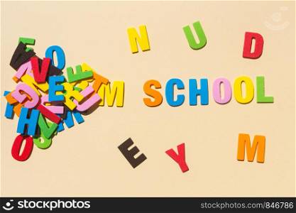 School written with colored letters and heap of letters