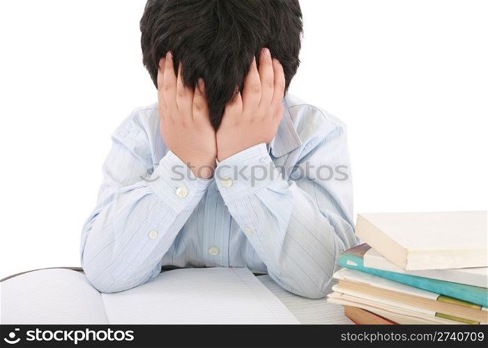 Schoolboy being stressed by his homework, isolated on white background
