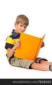Schoolboy is holding a book isolated on a white background