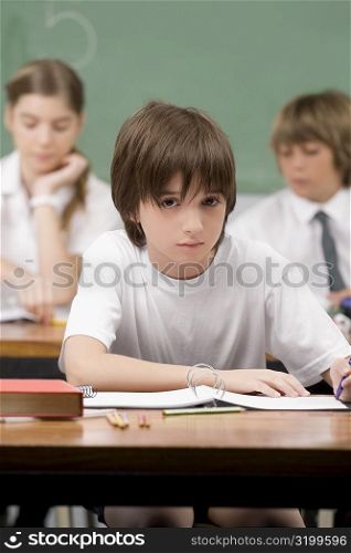 Schoolboy sitting in a classroom