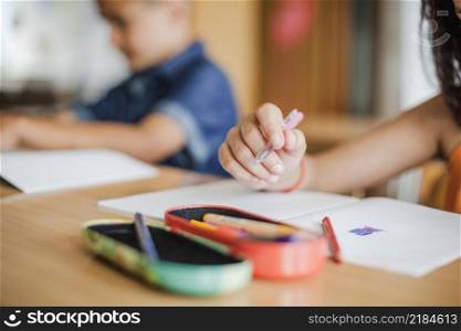 schoolchildren sitting desk with notebooks