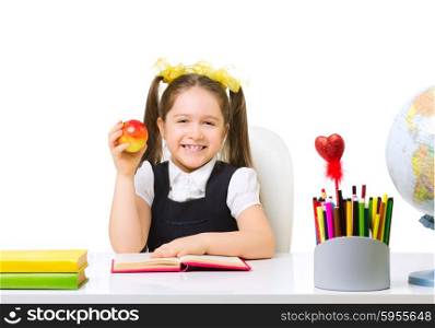 Schoolgirl at the table isolated