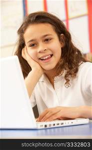 Schoolgirl In IT Class Using Computer