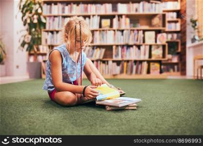 Schoolgirl reading and watching book in school library. Doing homework. Books on shelves in bookstore. Learning from books. Back to school. Elementary education
