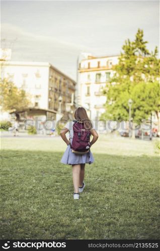 schoolgirl walking city park