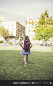 schoolgirl walking city park