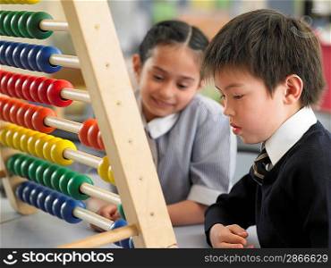 Schoolkids Using an Abacus