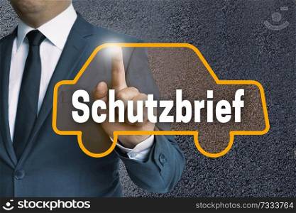 schutzbrief (in german insurance) car touchscreen is operated by businessman concept.. schutzbrief (in german insurance) car touchscreen is operated by businessman concept
