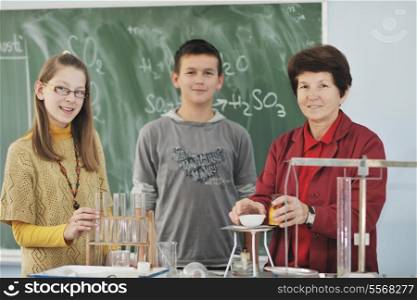 science and chemistry classees at school with smart children and teacher
