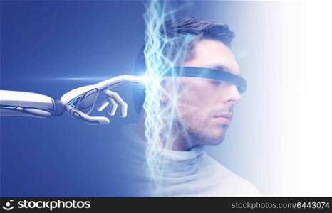 science and future technology concept - robot hand connecting to virtual low poly hologram over male head on blue background. robot hand connecting to virtual network