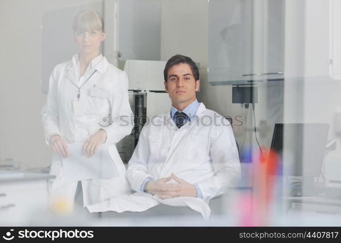 science and research biology chemistry an dmedicine youn people couple in bright modern lab