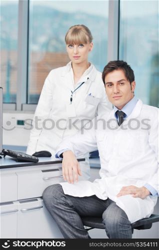 science and research biology chemistry an dmedicine youn people couple in bright modern lab