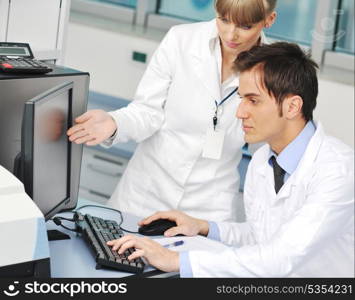 science and research biology chemistry an dmedicine youn people couple in bright modern lab