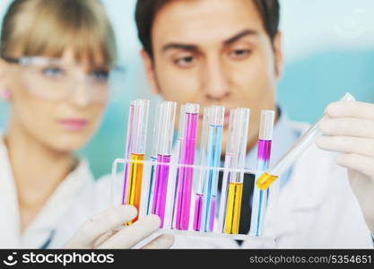 science and research biology chemistry an dmedicine youn people couple in bright modern lab