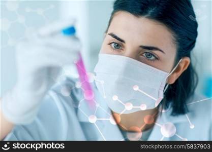 science, chemistry, biology, medicine and people concept - close up of young female scientist holding tube with sample making and test or research in clinical laboratory