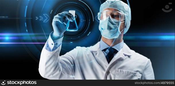 science, chemistry, research and people concept - young scientist in protective mask, hat and goggles holding test flask with chemical over dark background and virtual projections. scientist in mask holding flask with chemical