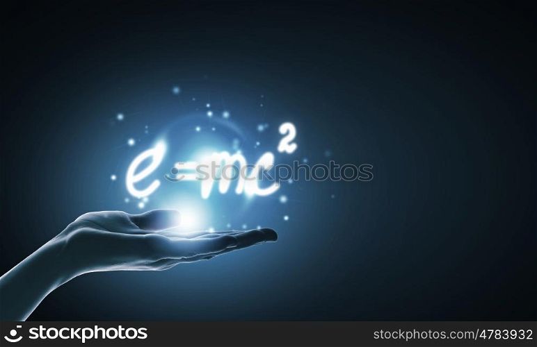 Science concept. Close up of hand holding science formula icon
