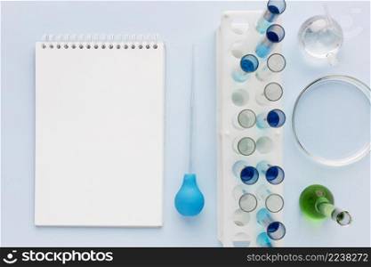 science elements lab with empty notepad