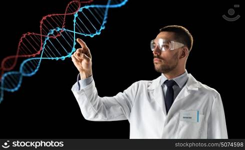 science, genetics and people concept - male doctor or scientist in white coat and safety glasses touching touching virtual projection of dna molecule over black background. scientist in goggles with dna molecule