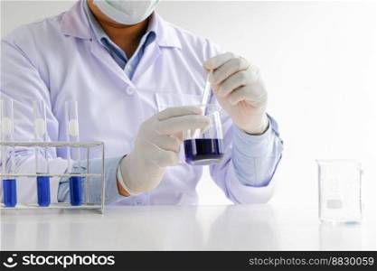 Science innovative Male medical or scientific laboratory researcher performs tests with liquid in laboratory. equipment science experiments technology Coronavirus Covid-19 vaccine research