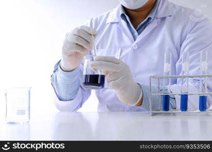 Science innovative Male medical or scientific laboratory researcher performs tests with liquid in laboratory. equipment science experiments technology Coronavirus Covid-19 vaccine research