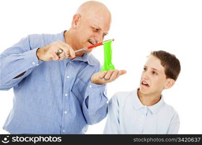 Science teacher showing a plasma-like substance to a student. The boy is completely disgusted. Isolated on white.