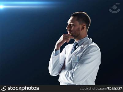 science, technology and people concept - doctor or scientist in white coat over black background. doctor or scientist in white coat