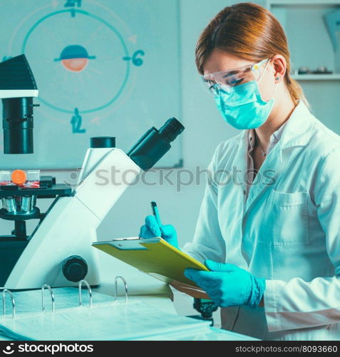 Scientific laboratory research Biotechnology scientist taking notes