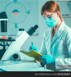 Scientific laboratory research Biotechnology scientist taking notes