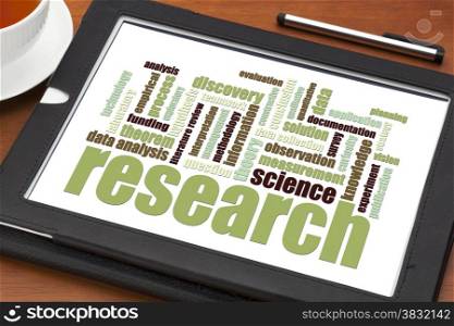 scientific research word cloud on a digital tablet - science concept