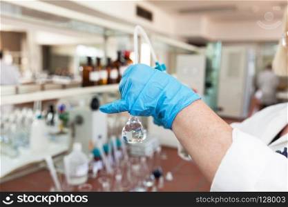 Scientist analyzing sample of the water in the laboratory