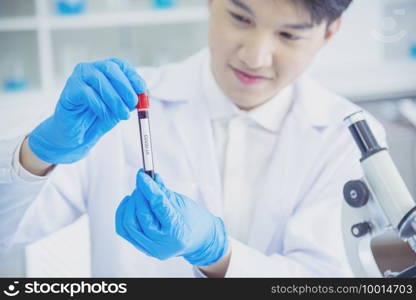 Scientist covid-19 virus chemistry  research experiment biotech antibody s&le laboratory cultivate vaccine against virus. Scientist look at microscope, science test tube analyse Chemistry laboratory