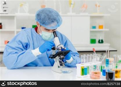 Scientist Doctor in research lab working observer dangerous virus with microscope.