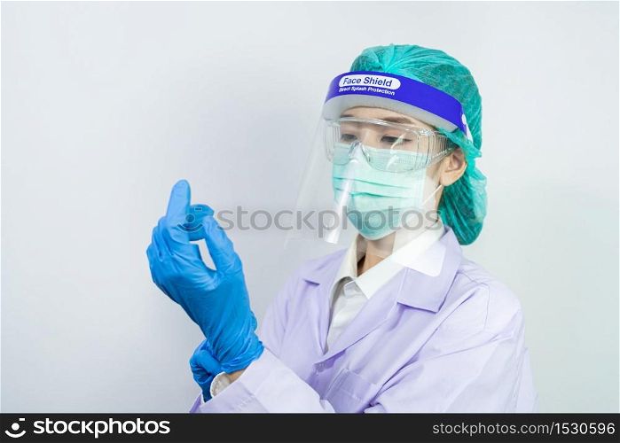 Scientist doctor wearing face mask, glasses or goggles and protective suit to fight coronavirus pandemic Covid-19, coronavirus pandemic threat quarantine, medical and healthcare concept