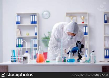 Scientist doing animal experiment in lab with rabbit