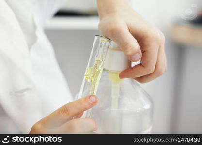 scientist filling test tube