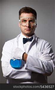 Scientist in glasses against grey background