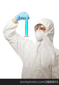 Scientist in protective wear and glasses looking at flask with reagent