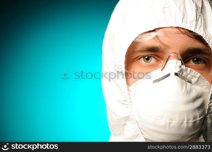 Scientist in protective wear, glasses and respirator