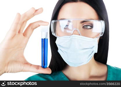 scientist looking at tube with blue liquid on white background