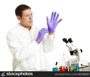Scientist putting on rubber gloves to protect from chemicals. Isolated on white.