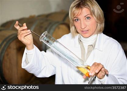 Scientist testing wine