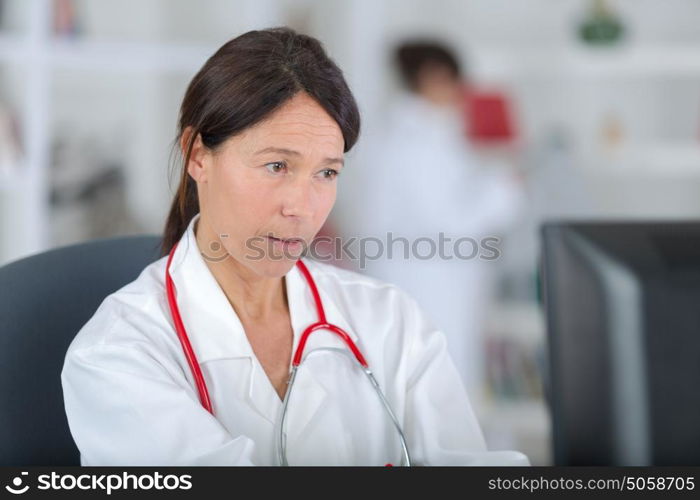 scientist using laptop in laboratory