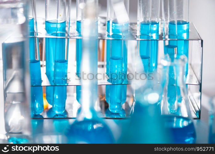 scientist with equipment and science experiments ,laboratory glassware containing chemical liquid for design or decorate science or other your content and selective focus