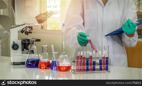 scientist with equipment. scientist with equipment and science experiments in laboratory