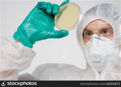 Scientist with petri dish