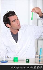 Scientist with test tube rack